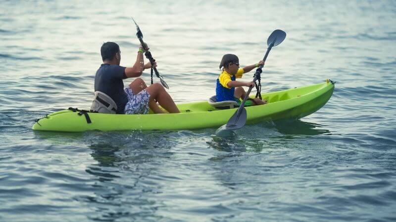 Father enjoy kayaking with kid